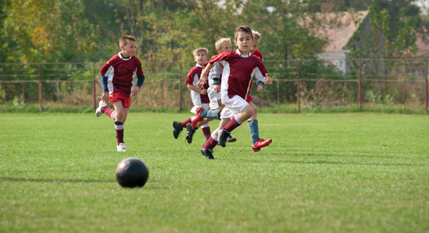 team members playing soccer